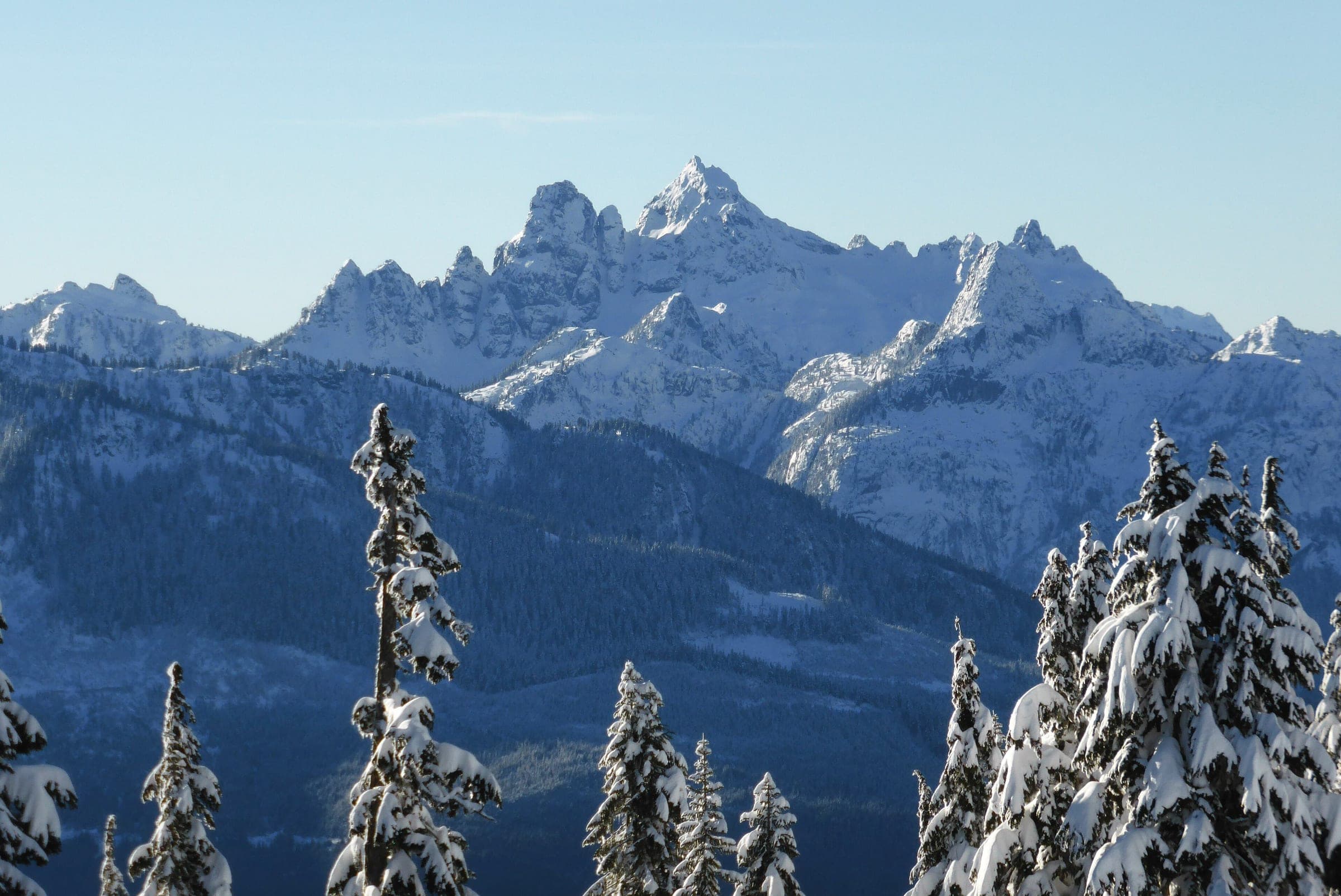 Snow covers the summit of Sky Pilot Mountain above Squamish in winter.