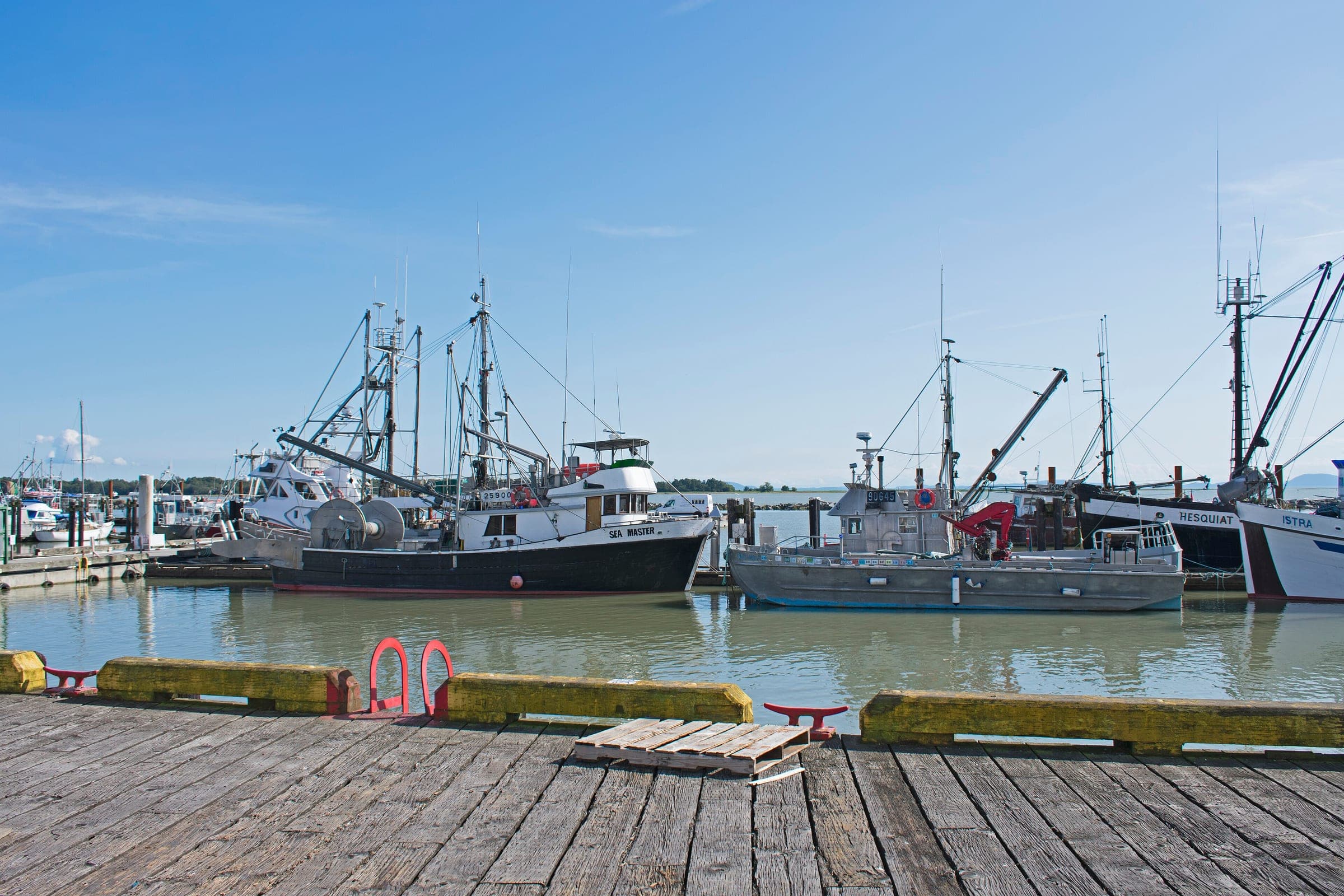 Fishing boats tie up in Steveston Harbour in the view from the Gulf of Georgia Cannery boardwalk.
