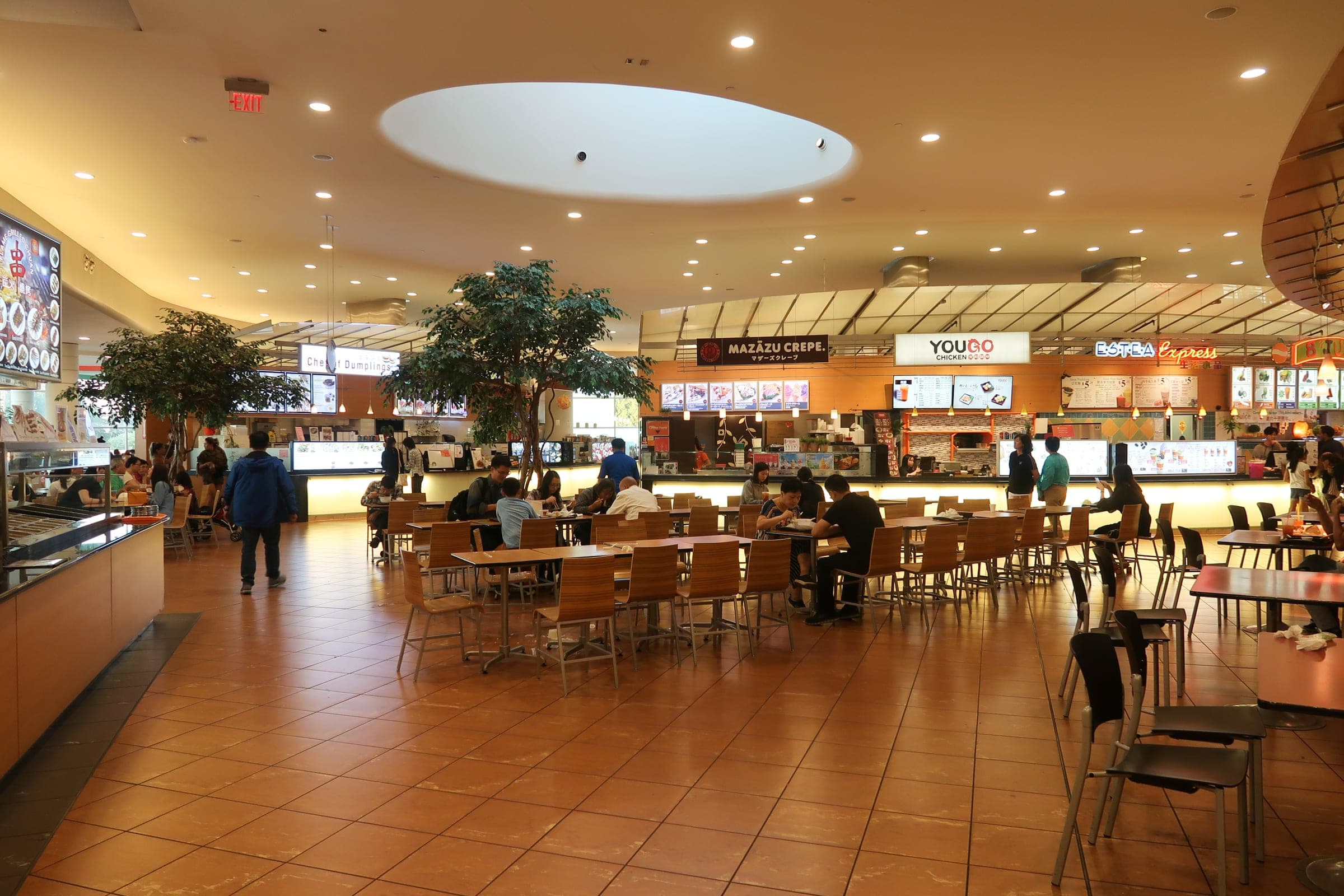 Diners sit at tables under a round ceiling dome in the food court at Aberdeen Centre in Richmond.