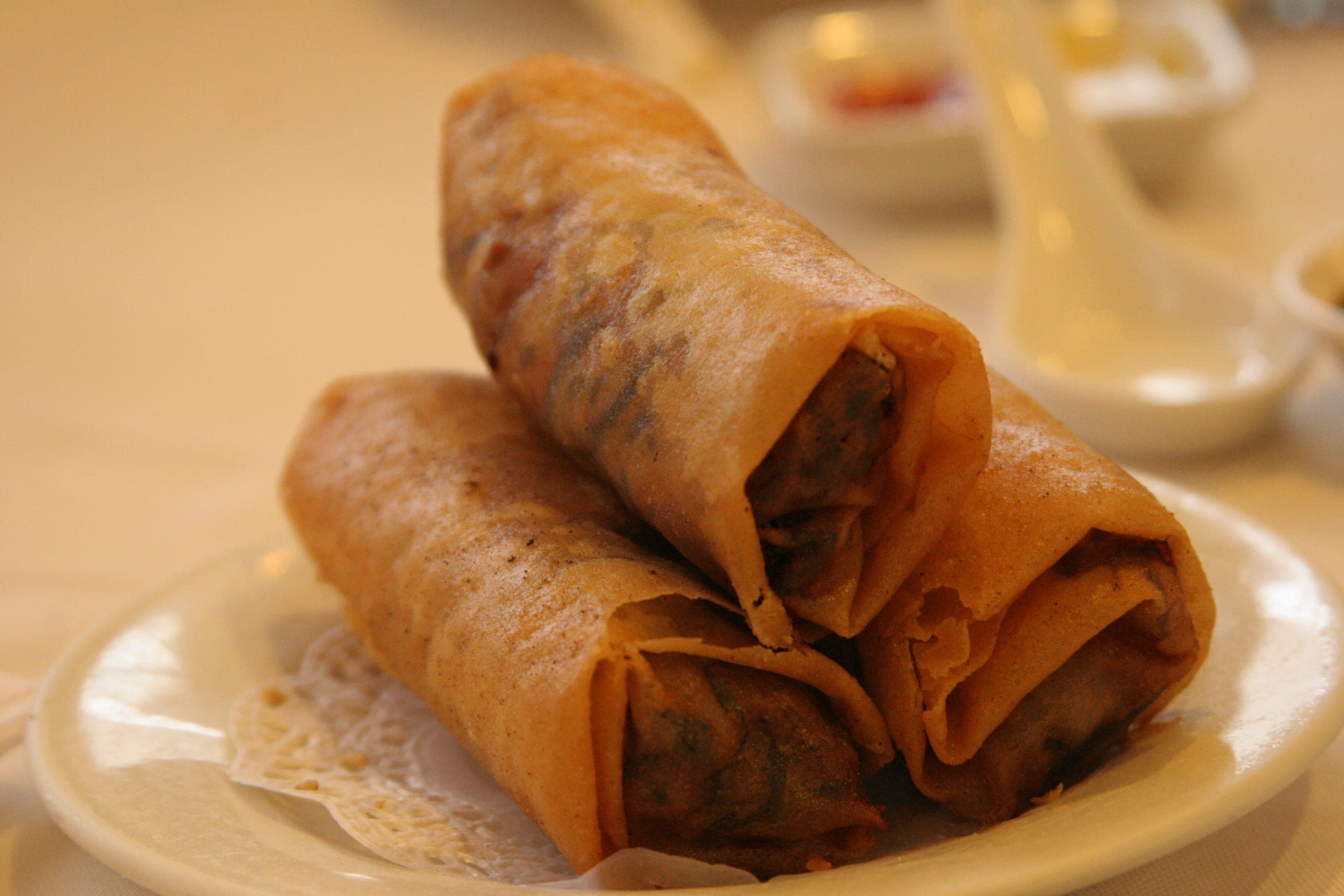 Crisp spring rolls stacked on a small plate during a dim sum brunch at Gala in Richmond.