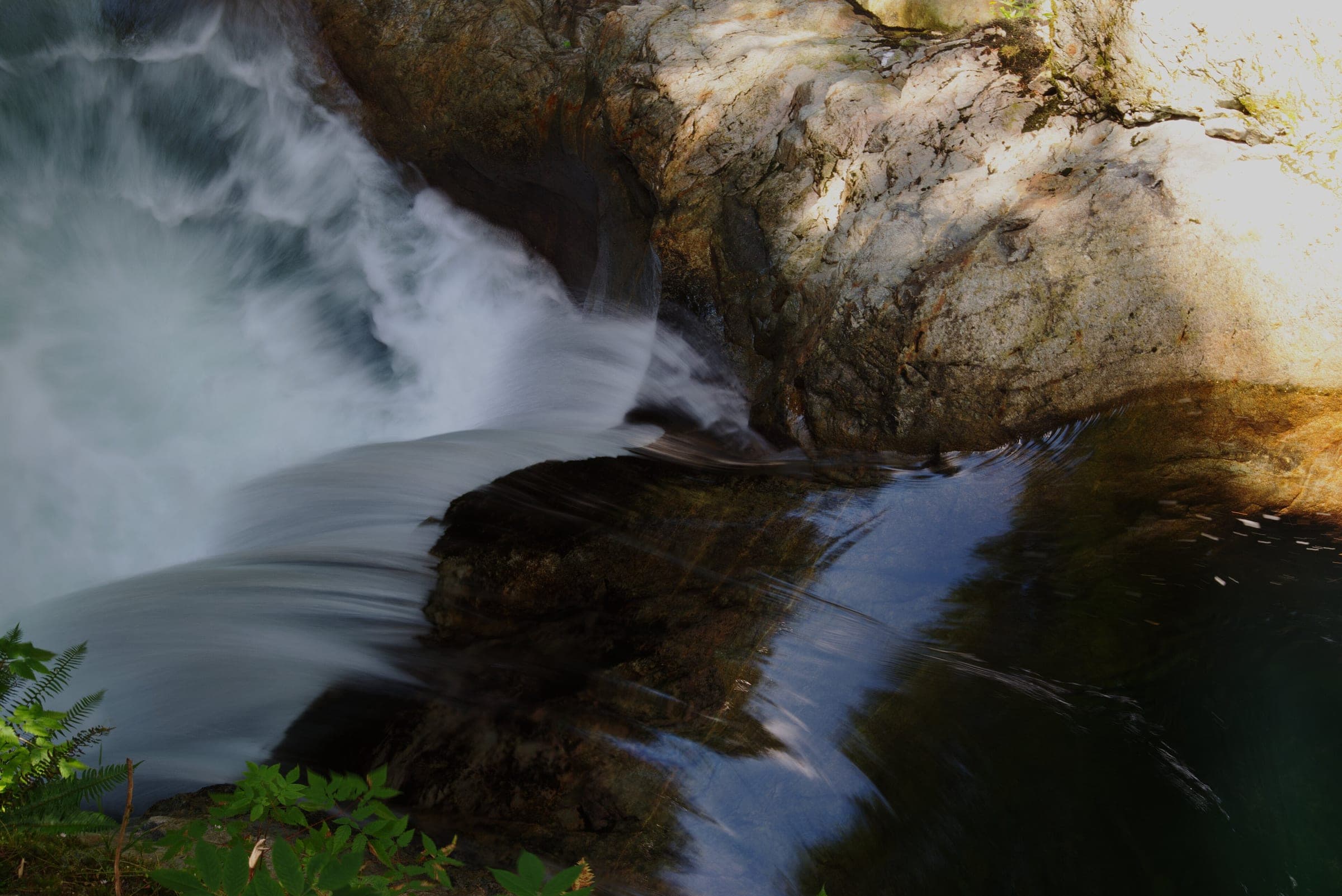 Lynn Creek pours over a granite lip at Twin Falls on the loop through Lynn Canyon Park.