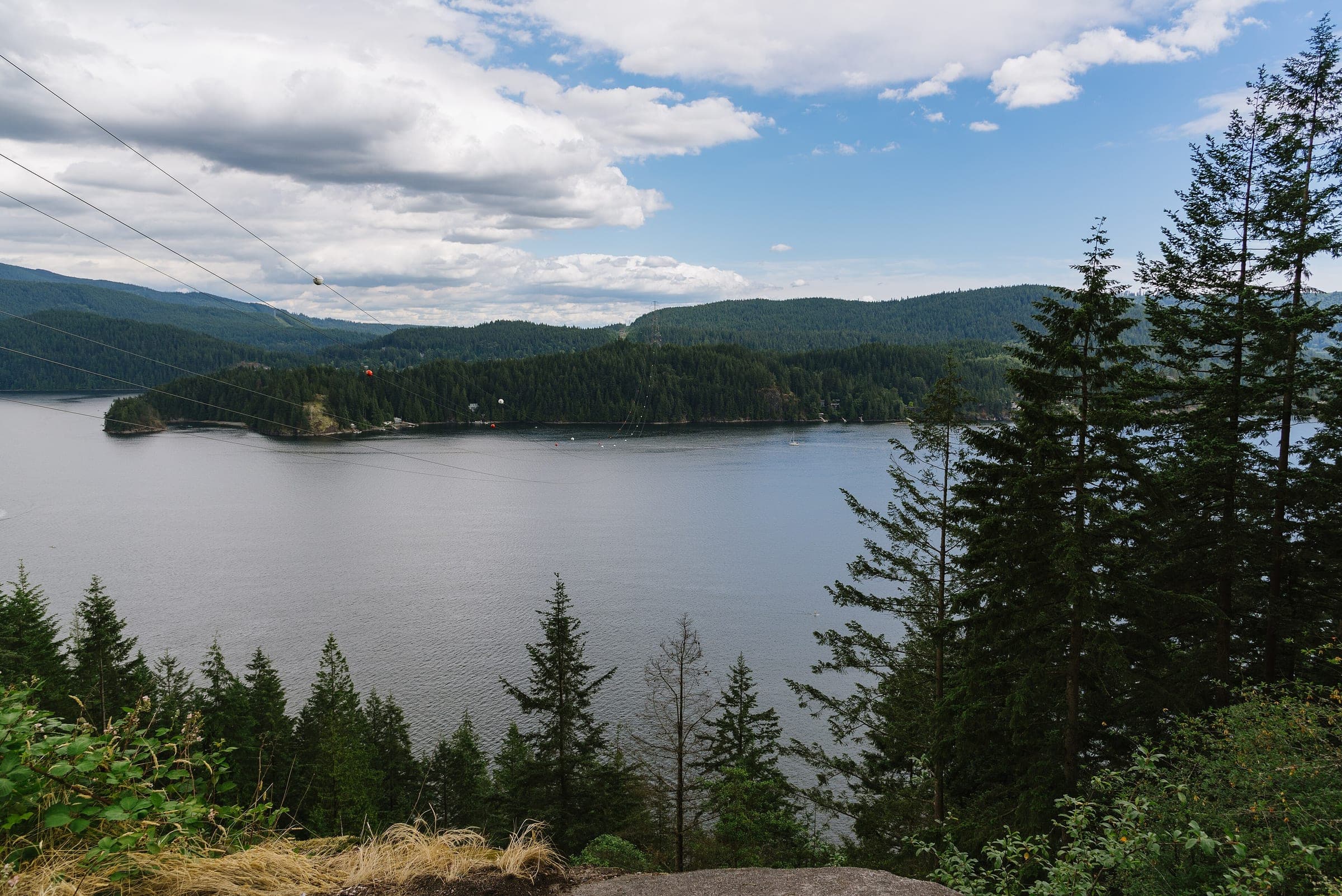 Indian Arm and Belcarra's forested shore spread out below the lookout at Quarry Rock above Deep Cove.