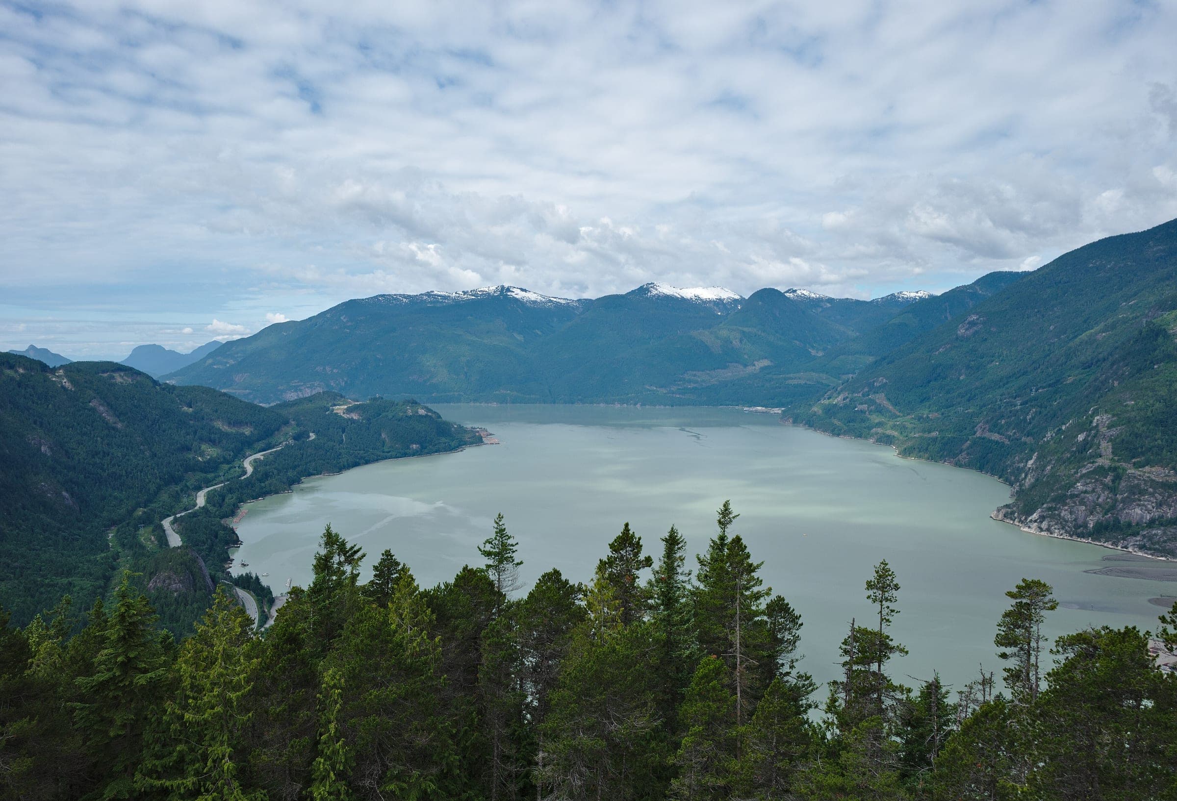 Howe Sound stretches south between snow-dusted ridges in the view from the top of the Stawamus Chief.