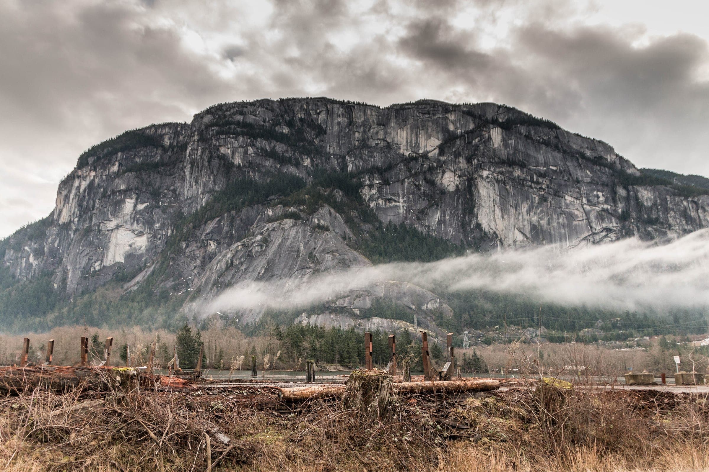 Low mist hangs below the granite walls of the Stawamus Chief above Squamish on a January morning.