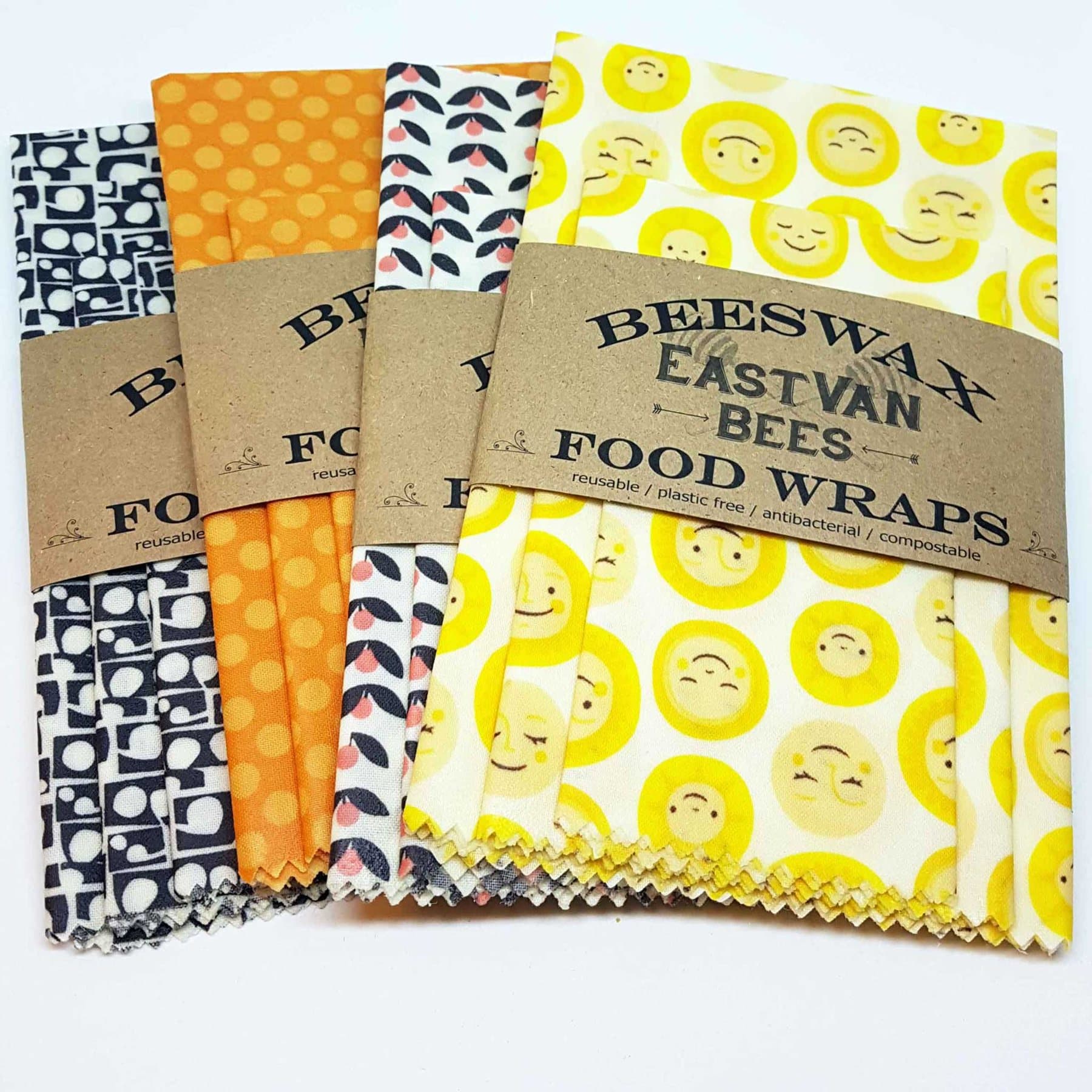 Packs of EastVan Bees beeswax food wraps in patterned cotton.