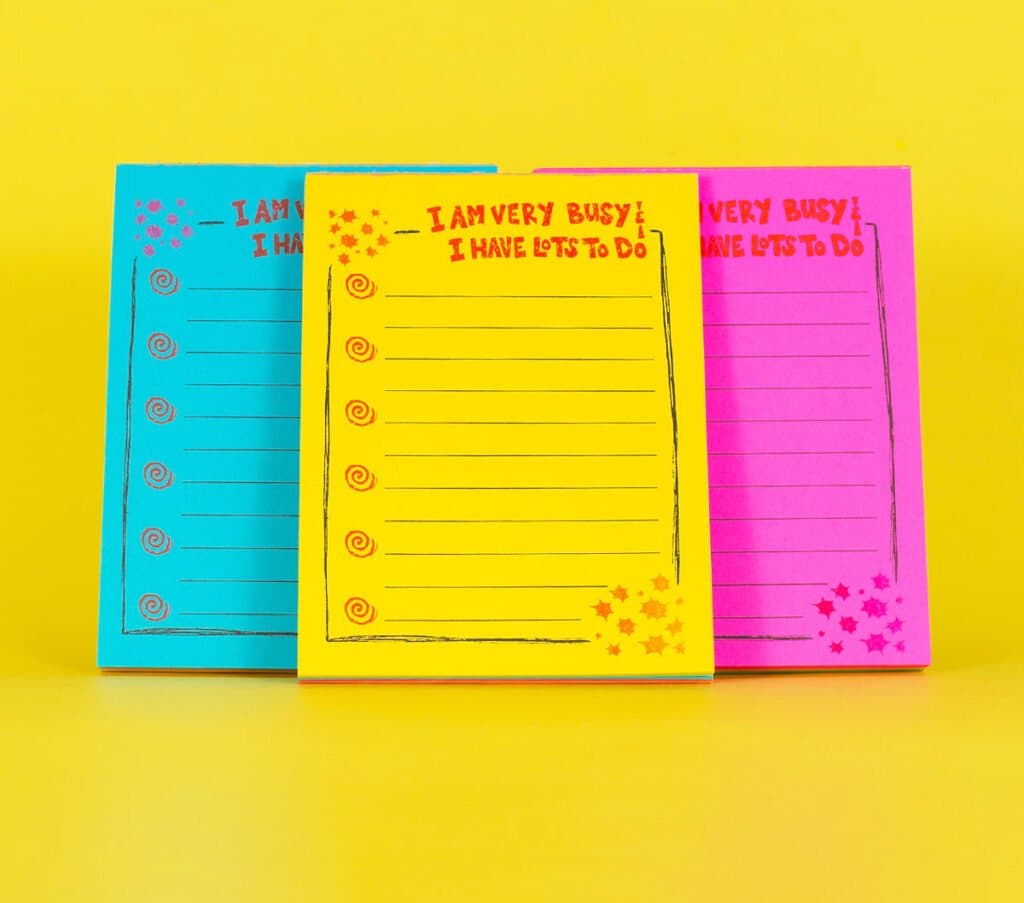 Three risograph to-do notepads from Steph Ford Studio in teal, yellow and pink.