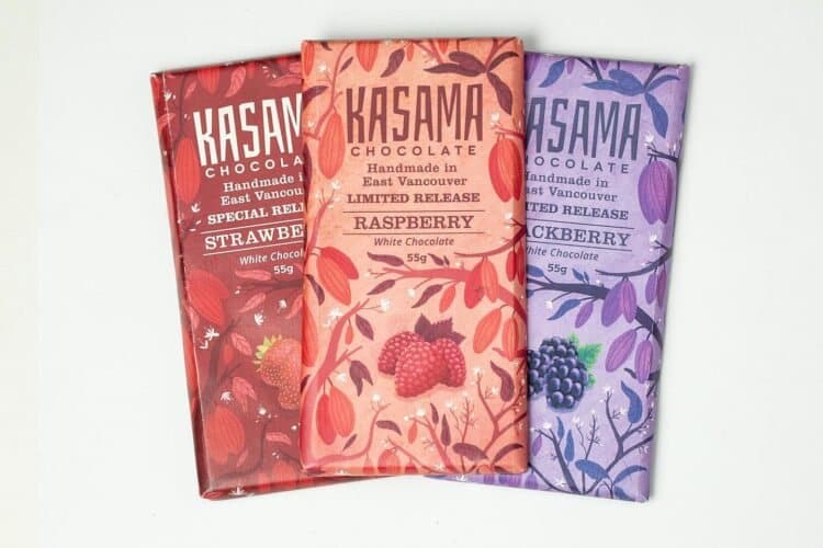 Three Kasama Chocolate white chocolate bars in strawberry, raspberry and blackberry wrappers.