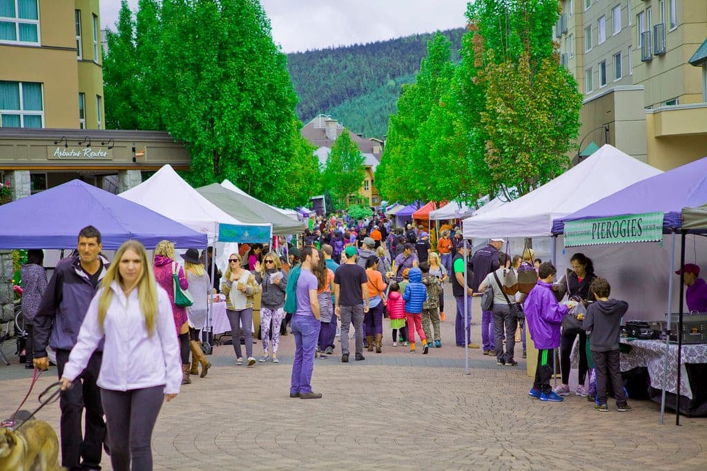 Crowds move between tents at the Whistler Farmers Market in the Upper Village