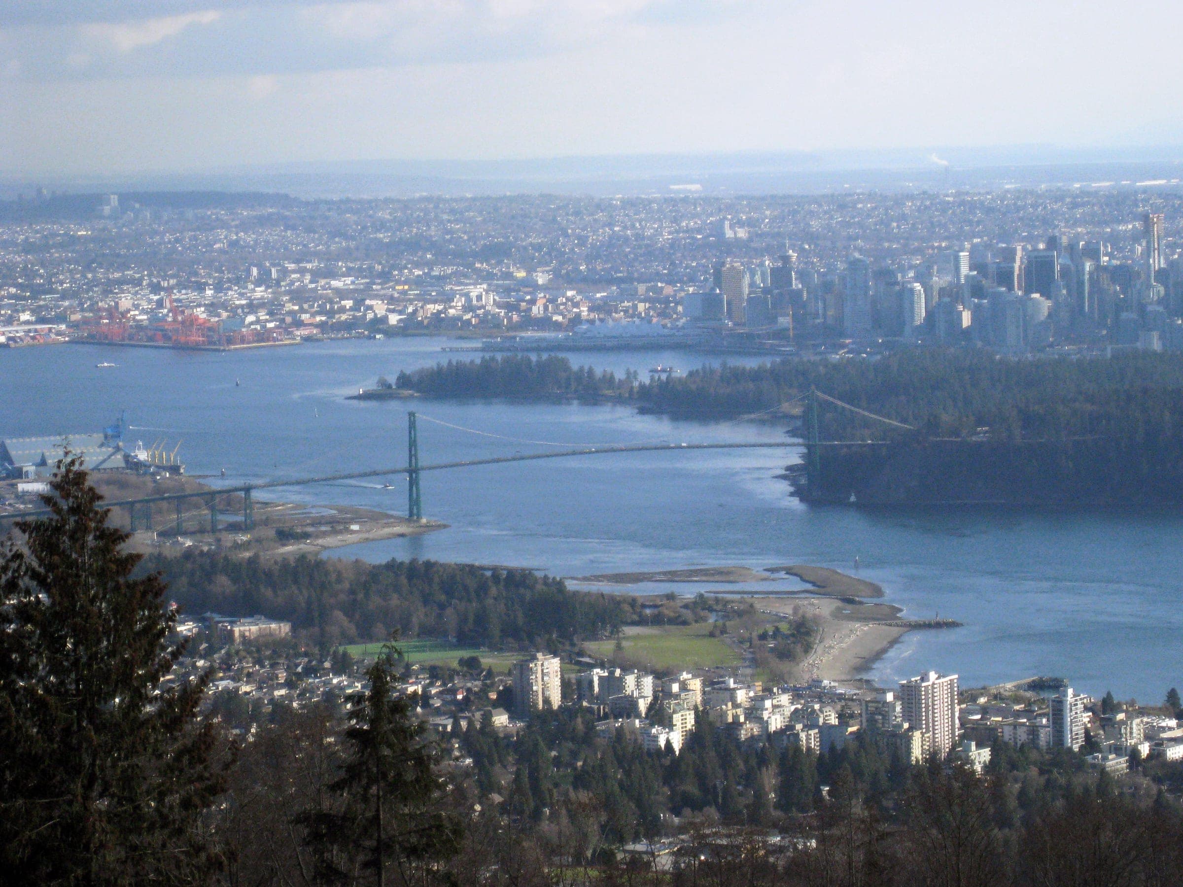 The Lions Gate Bridge spans Burrard Inlet below Stanley Park in the view from the Cypress Bowl Road lookout.