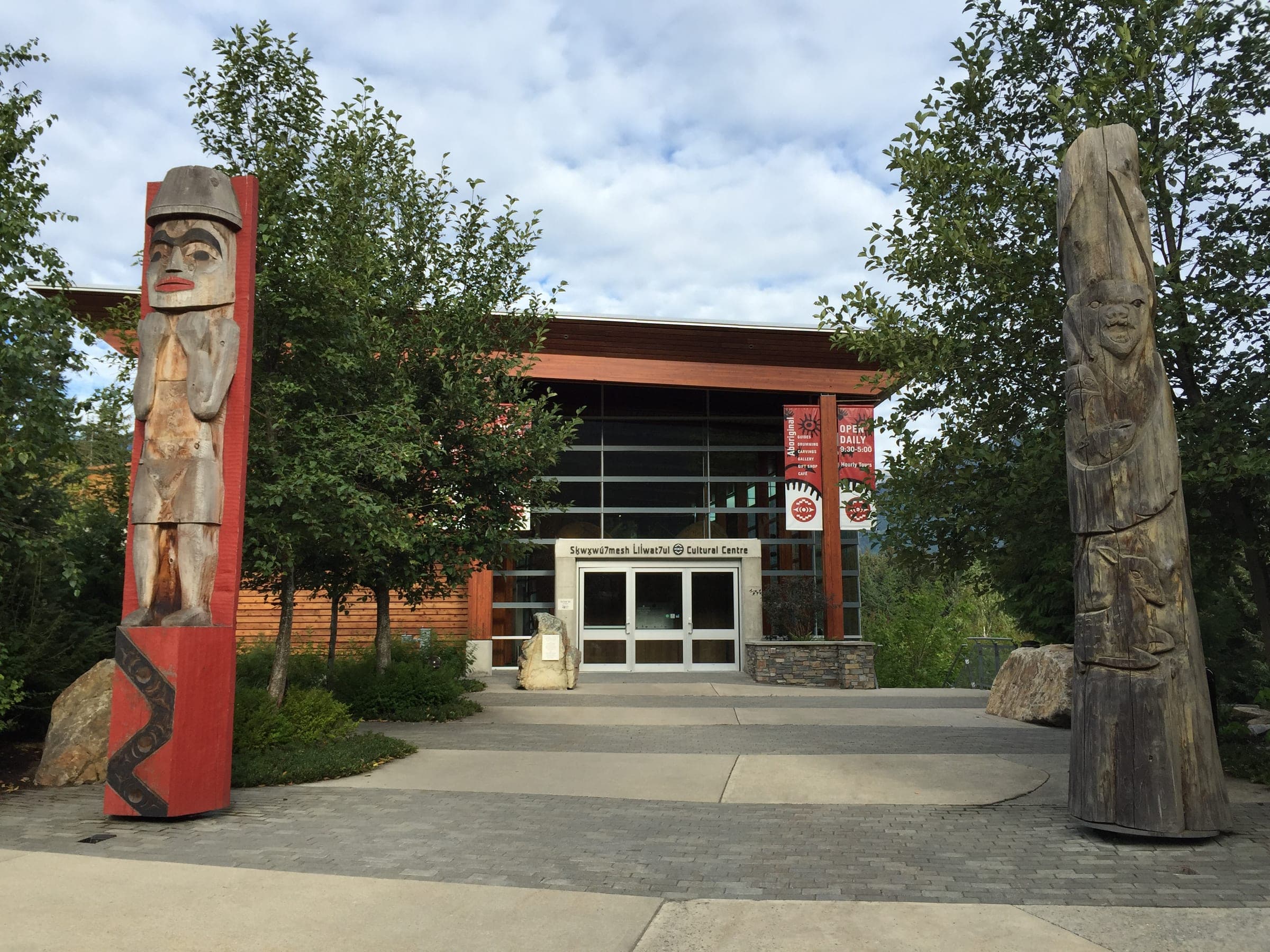 Carved house posts flank the entrance of the Squamish Lil'wat Cultural Centre in Whistler.