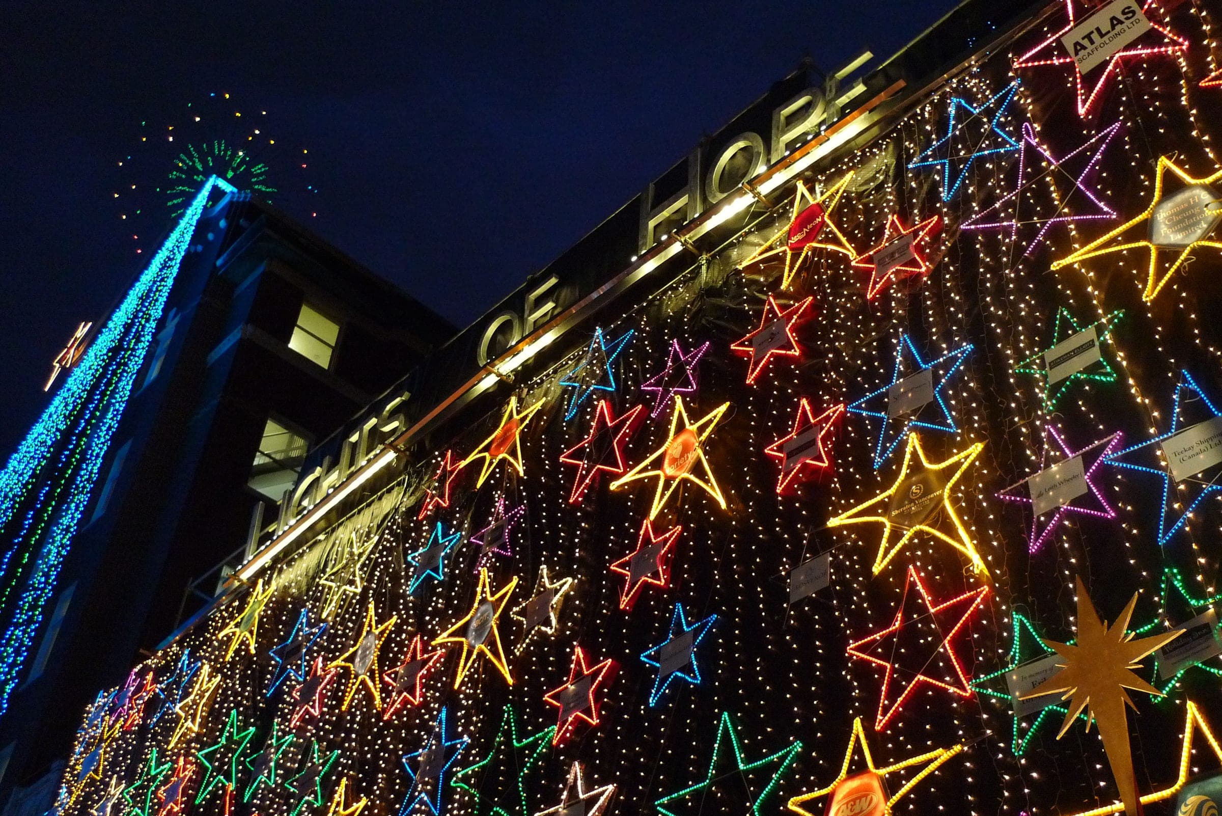 Coloured stars and a tree of blue lights cover St. Paul's Hospital across Burrard Street for Lights of Hope.