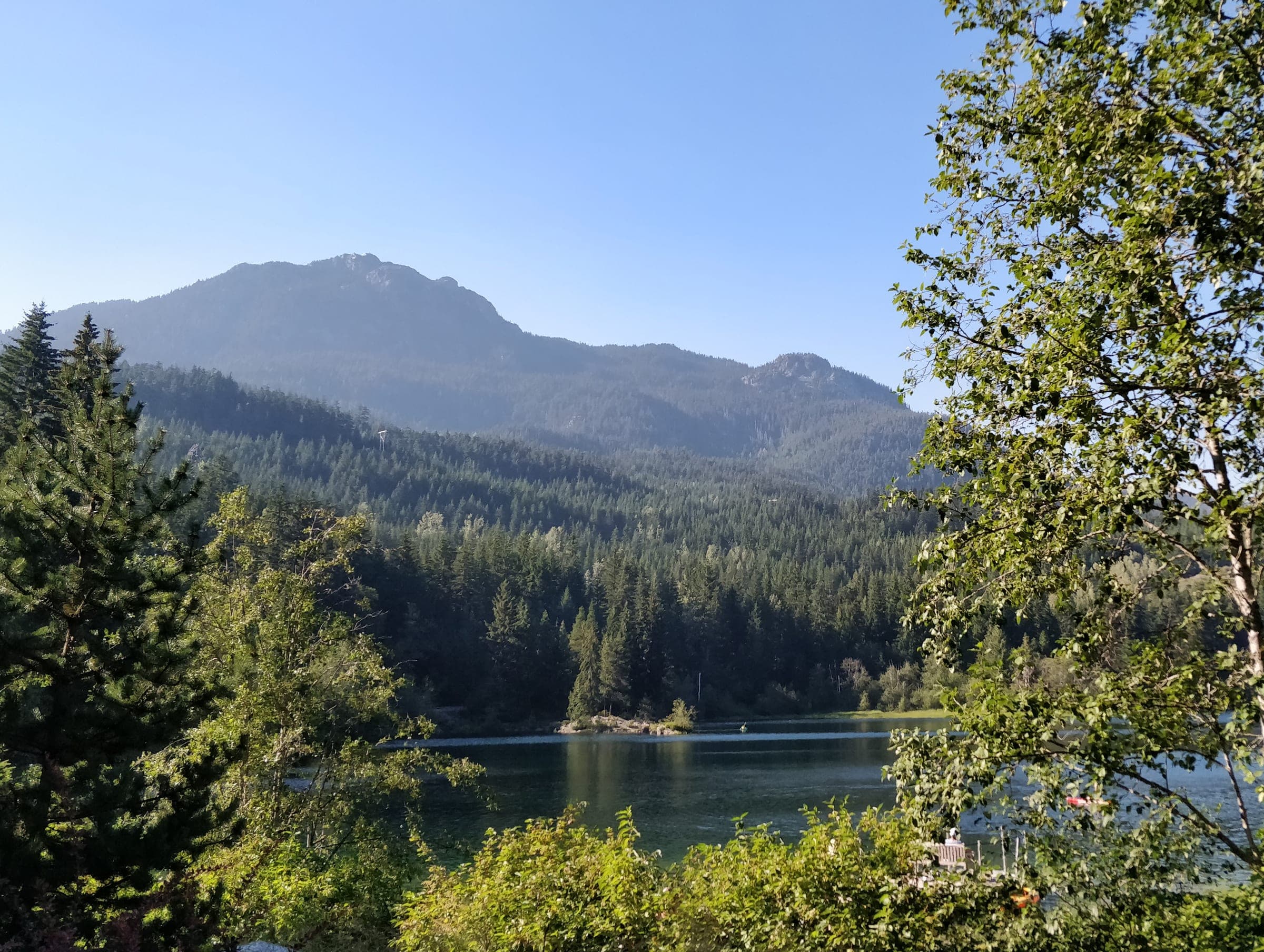 Nita Lake and the forested ridge above Whistler Creekside seen from the Nita Lake Lodge patio.