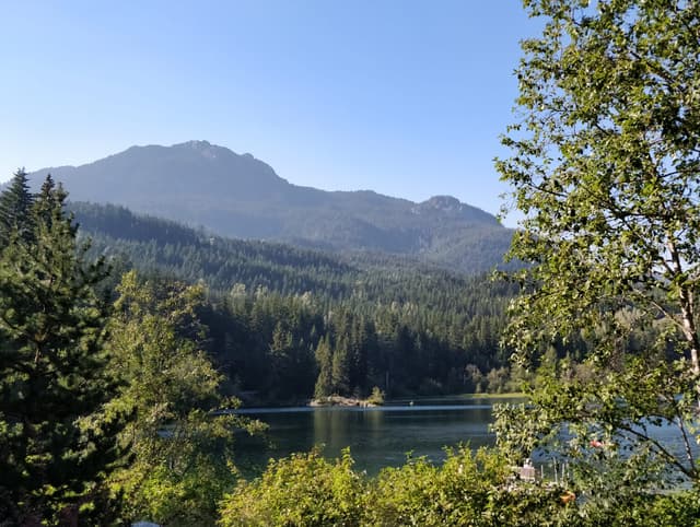 Nita Lake and the forested ridge above Whistler Creekside seen from the Nita Lake Lodge patio.