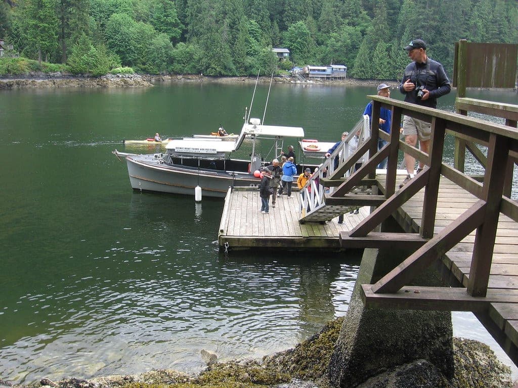 Boaters tie up at the public wharf on North Twin Island in Indian Arm below forested slopes.