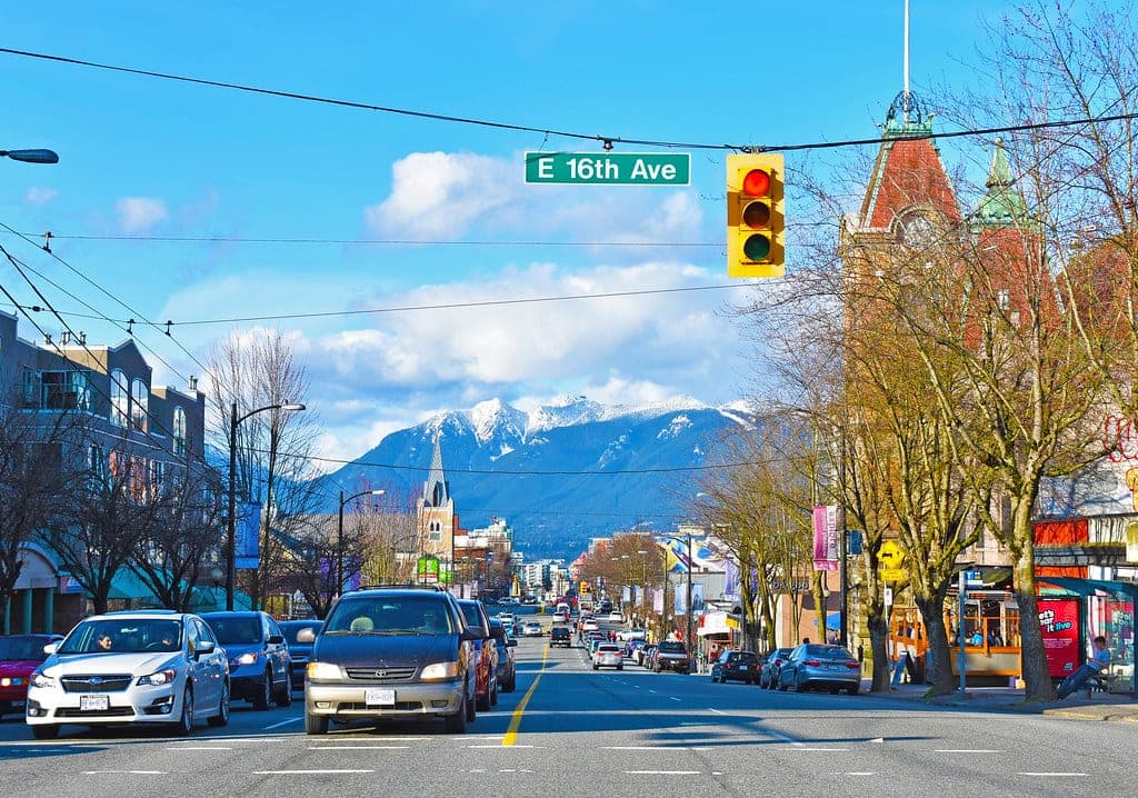 Main Street runs north from 16th Avenue past Heritage Hall toward the snowy peaks of the North Shore.